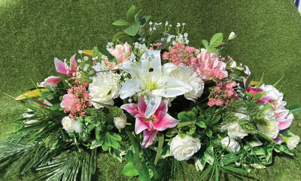 Silk coffin spray with white lilies and pink roses