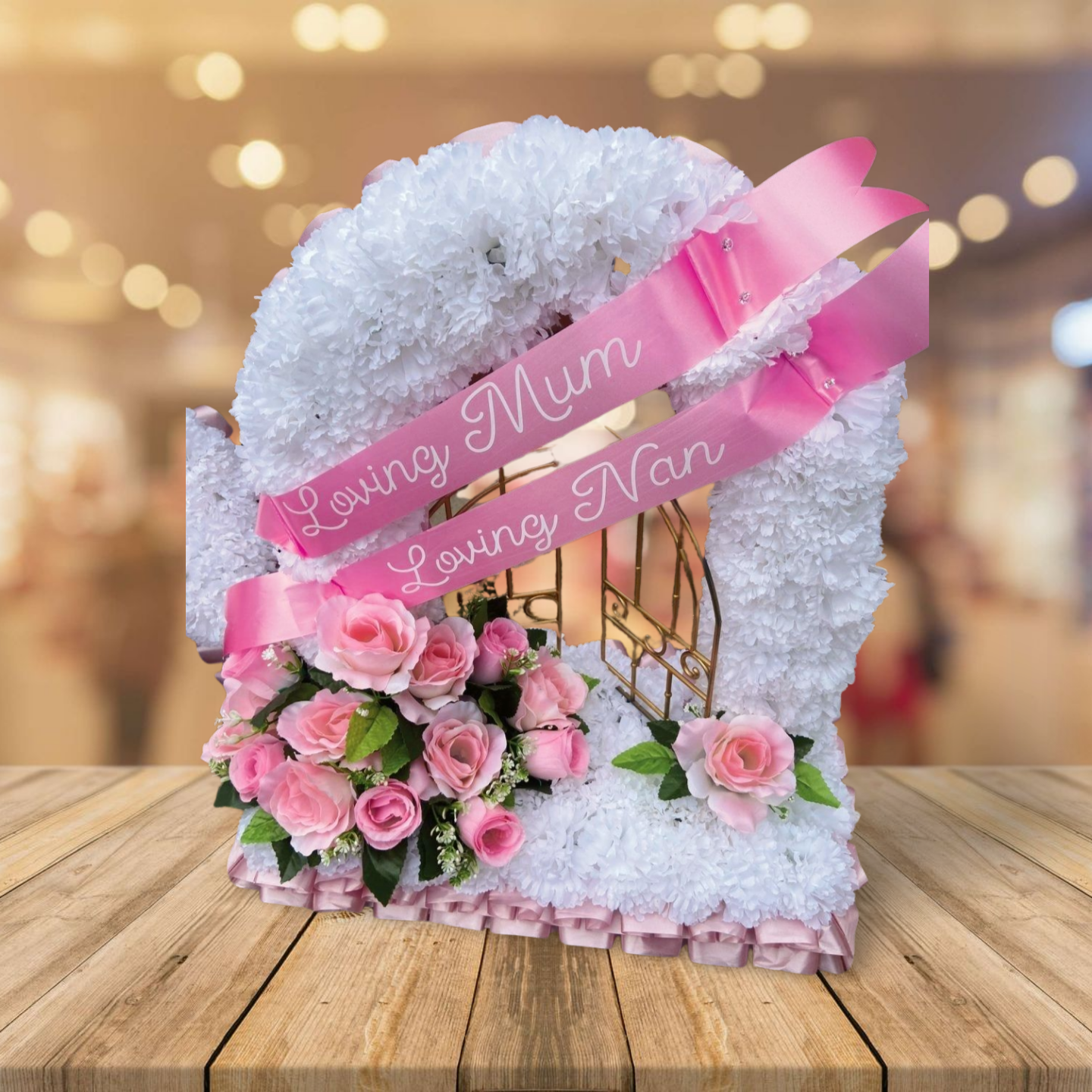 Red and white silk funeral flower arrangement for a grave